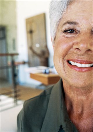 Senior woman smiling, partial view, close-up Stock Photo - Premium Royalty-Free, Code: 695-05774318