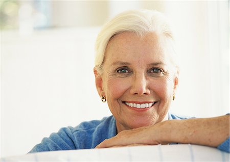 Mature woman smiling, portrait Stock Photo - Premium Royalty-Free, Code: 695-05774365