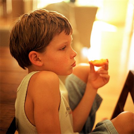pictures of pre teen boys in tank tops - Child eating, side view Stock Photo - Premium Royalty-Free, Code: 695-05774411