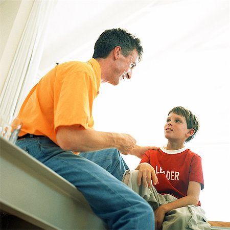simsearch:695-03385136,k - Father and son sitting, low angle view Stock Photo - Premium Royalty-Free, Code: 695-05774497