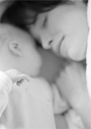 pregnant woman sleeping - Mother sleeping with infant, close-up, b&w Stock Photo - Premium Royalty-Free, Code: 695-05774634