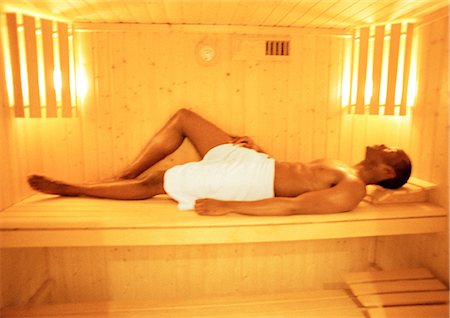 Man lying down in sauna, full length Stock Photo - Premium Royalty-Free, Code: 695-05774664