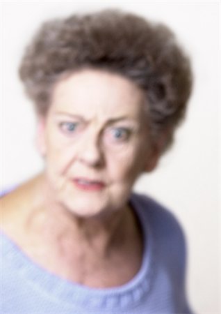simsearch:614-03647876,k - Senior woman making face, close-up, portrait, blurred Stock Photo - Premium Royalty-Free, Code: 695-05774803