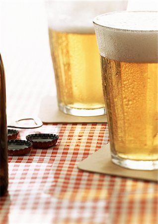 simsearch:695-05774838,k - Two glasses of beer on cafe table, close-up Stock Photo - Premium Royalty-Free, Code: 695-05774870