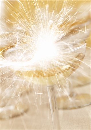 party background - Glass of champagne and sparkler, close-up Stock Photo - Premium Royalty-Free, Code: 695-05774889