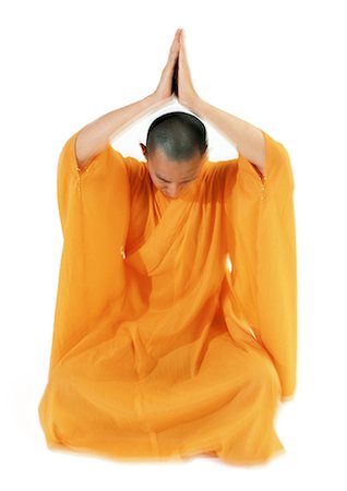 simsearch:695-03385803,k - Buddhist monk meditating with hands together over head Stock Photo - Premium Royalty-Free, Code: 695-05774917