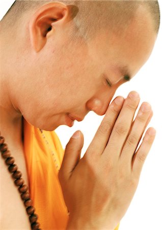 shaved head profile asian - Buddhist monk meditating, side view, close-up Stock Photo - Premium Royalty-Free, Code: 695-05774921