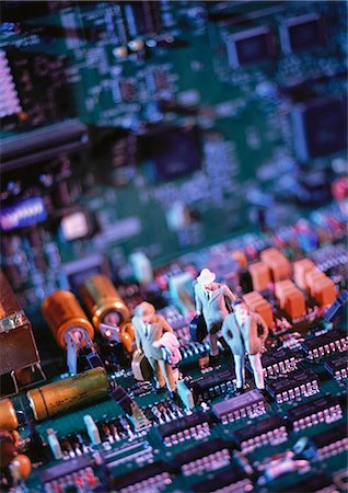 figurines businessman - Toy figures on computer circuit board, close-up Stock Photo - Premium Royalty-Free, Code: 695-05774964