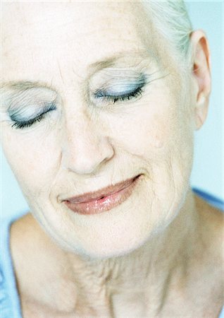 elderly woman beauty - Mature woman smiling, eyes closed, portrait. Stock Photo - Premium Royalty-Free, Code: 695-05775074