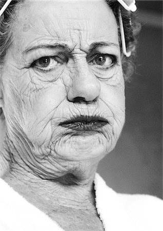 Elderly woman pouting, portrait, close-up, b&w Stock Photo - Premium Royalty-Free, Code: 695-05775088
