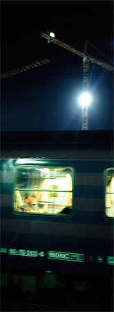 Subway train at night, crane and flood light in background, blurred Fotografie stock - Premium Royalty-Free, Codice: 695-05775198