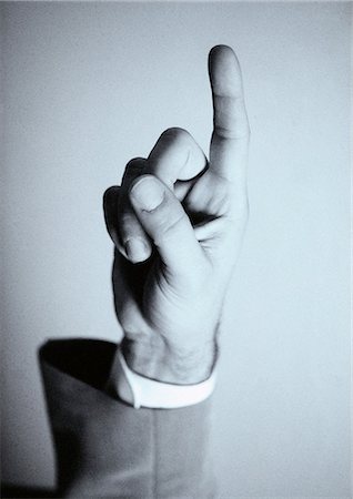 finger up - Hand, finger pointing up Stock Photo - Premium Royalty-Free, Code: 695-05775378