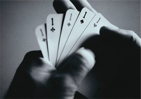 Hands holding playing cards, close-up Stock Photo - Premium Royalty-Free, Code: 695-05775388