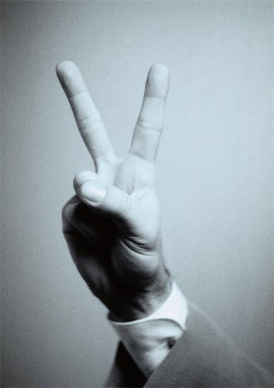 Hand making peace sign, close-up Stock Photo - Premium Royalty-Free, Image code: 695-05775382