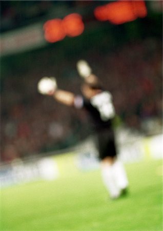 soccer goalkeeper backside - Goal keeper, side view, blurred. Stock Photo - Premium Royalty-Free, Code: 695-05775836