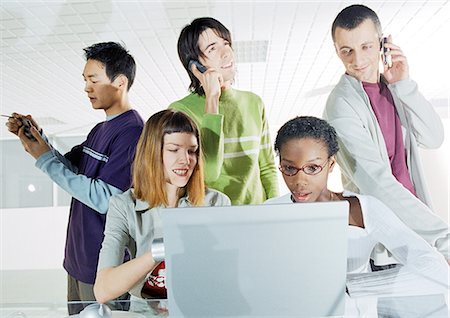 simsearch:695-05776257,k - Group of people gathered around computer Stock Photo - Premium Royalty-Free, Code: 695-05775946