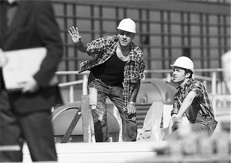 Builders with hard hats, talking, b&w Stock Photo - Premium Royalty-Free, Code: 695-05776067