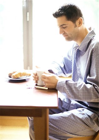 Man having breakfast Stock Photo - Premium Royalty-Free, Code: 695-05776118