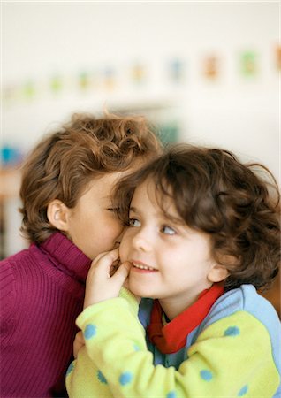 simsearch:695-05776481,k - Two children, one whispering to the other Stock Photo - Premium Royalty-Free, Code: 695-05776423