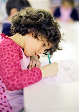 simsearch:695-05776481,k - Child in classroom, writing, side view Stock Photo - Premium Royalty-Free, Code: 695-05776446