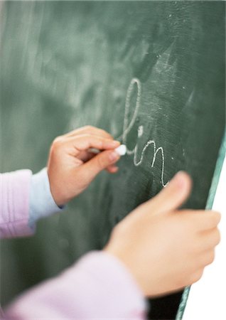 simsearch:695-05776481,k - Child writing on chalkboard, close-up Stock Photo - Premium Royalty-Free, Code: 695-05776476