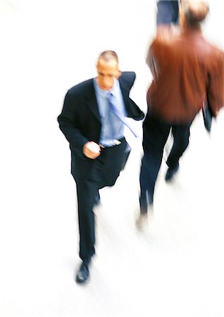 simsearch:695-05773323,k - Businessman walking, elevated view, blurred Stock Photo - Premium Royalty-Free, Code: 695-05776492