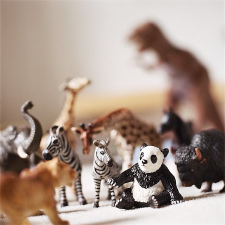 dinosaur gathering - Plastic toy animal figurines Stock Photo - Premium Royalty-Free, Code: 695-05776537