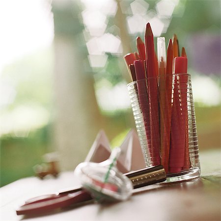 Cup of pencils and markers on table Stock Photo - Premium Royalty-Free, Code: 695-05776530