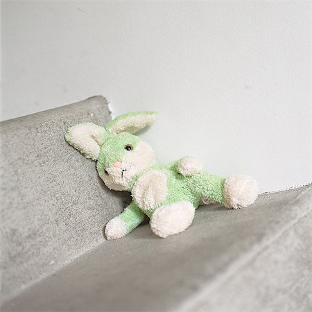 stuffed animals bunny - Stuffed rabbit sitting on step Stock Photo - Premium Royalty-Free, Code: 695-05776540