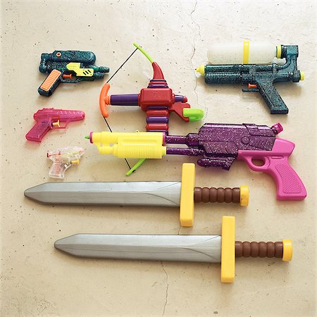 Children's toy swords and guns Foto de stock - Sin royalties Premium, Código: 695-05776543