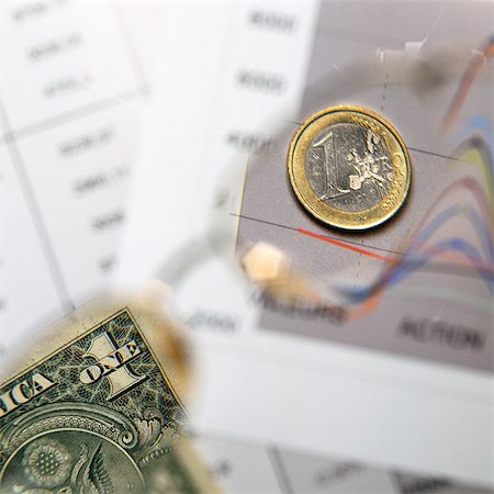 U.S. dollar and Euro on top of financial charts Stock Photo - Premium Royalty-Free, Code: 695-05776579