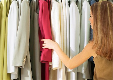 rear view shopping - Girl in front of rack of suits, rear view Stock Photo - Premium Royalty-Free, Code: 695-05776705