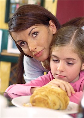 Mother sitting close to daughter. Stock Photo - Premium Royalty-Free, Code: 695-05776729