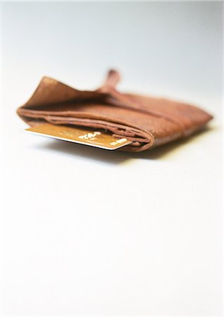 Wallet, end of credit card sticking out, close-up Foto de stock - Sin royalties Premium, Código: 695-05776746