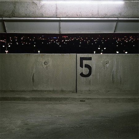 scare night - City lights seen through parking lot window Stock Photo - Premium Royalty-Free, Code: 695-05777082