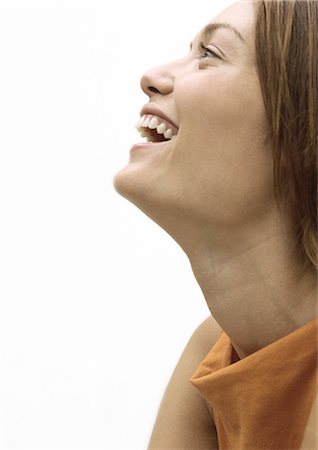 Woman laughing, profile portrait Foto de stock - Royalty Free Premium, Número: 695-05777114