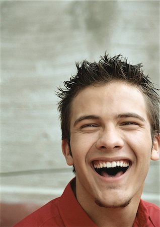 Teenage boy laughing, portrait Stock Photo - Premium Royalty-Free, Code: 695-05777136