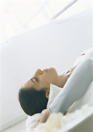 simsearch:695-05777385,k - Young woman lying down, close-up Stock Photo - Premium Royalty-Free, Code: 695-05777185