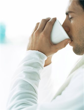 robe hand male - Man drinking from cup, eyes closed Stock Photo - Premium Royalty-Free, Code: 695-05777342