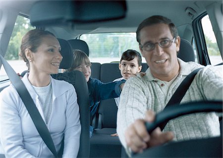 simsearch:700-00616908,k - Parents with boy and girl in car wearing seatbelts, interior view Stock Photo - Premium Royalty-Free, Code: 695-05777425