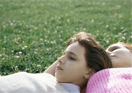 family relaxing with kids in the sun - Girl and mother lying on grass Stock Photo - Premium Royalty-Free, Code: 695-05777440
