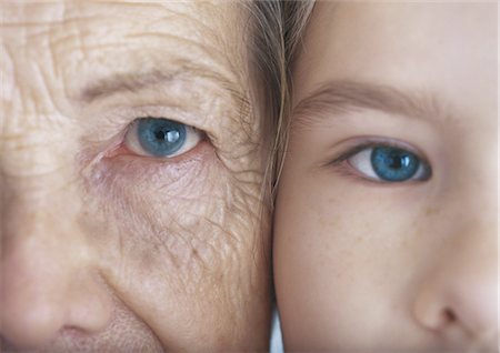 senior eyes - Grandmother and granddaughter cheek to cheek, extreme close-up Stock Photo - Premium Royalty-Free, Code: 695-05777531