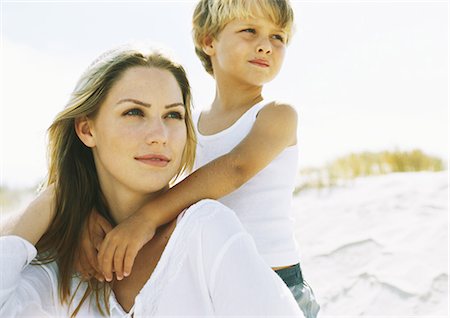 dunes family - Boy standing behind seated mother on beach, portrait Stock Photo - Premium Royalty-Free, Code: 695-05777928