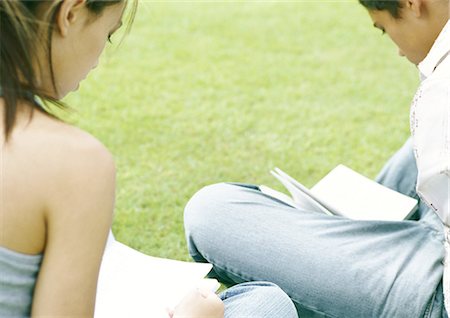 simsearch:633-03194783,k - Students sitting on grass studying, rear view Stock Photo - Premium Royalty-Free, Code: 695-05777980