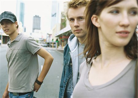 simsearch:695-05778554,k - Young people standing in street Fotografie stock - Premium Royalty-Free, Codice: 695-05778017