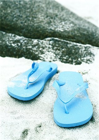 stone in shoe - Flipflops on beach Stock Photo - Premium Royalty-Free, Code: 695-05778384