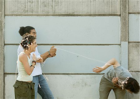 simsearch:695-03383828,k - Young people playing with party string Stock Photo - Premium Royalty-Free, Code: 695-05778568