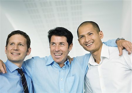 simsearch:693-06380019,k - Three businessmen with arms around each others' shoulders Stock Photo - Premium Royalty-Free, Code: 695-05778604