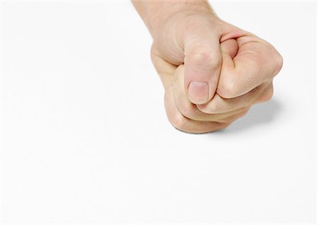 fist on table - Fist Stock Photo - Premium Royalty-Free, Code: 695-05778690