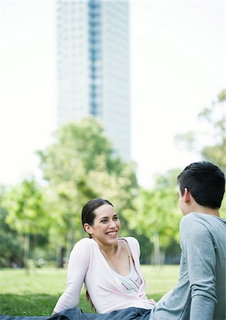 Young couple sitting in urban park Stock Photo - Premium Royalty-Free, Code: 695-05778771